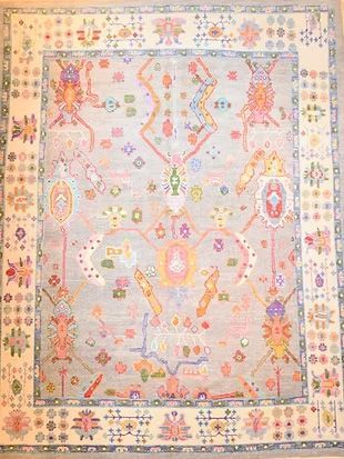 A rug with a floral pattern on it is sitting on a table.