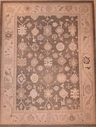 A rug with a pattern on it is sitting on a table.