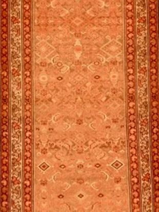 A close up of a rug with a pattern on it.