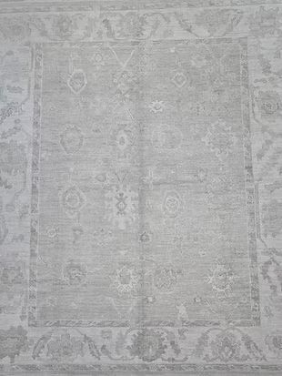 A close up of a rug with a floral pattern on it.