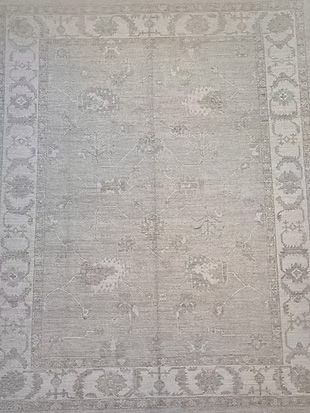 A close up of a rug with a floral pattern on it.