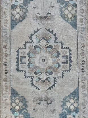A close up of a rug with a floral pattern on it.