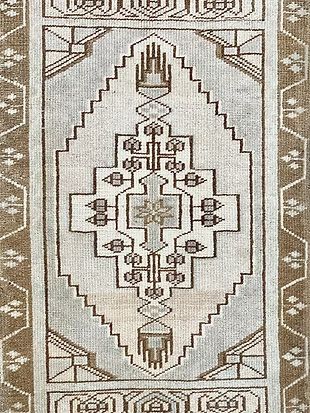 A close up of a rug with a geometric pattern on it.