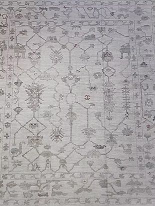 A close up of a rug with a pattern on it.