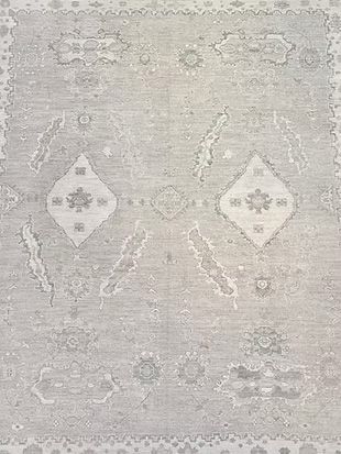 A close up of a rug with a pattern on it.