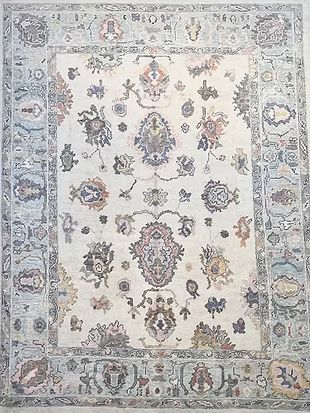A rug with a floral pattern on it is sitting on a table.