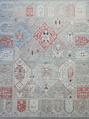 A close up of a rug with a pattern on it.