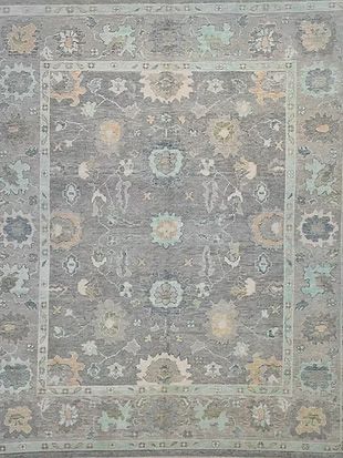 A gray rug with a floral pattern on it
