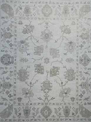 A white rug with a floral pattern on it.