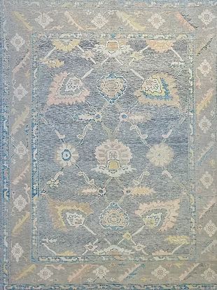 A close up of a rug with a floral pattern on it.