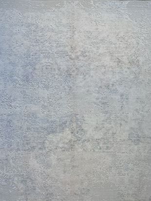 A close up of a gray wall with a marble texture.