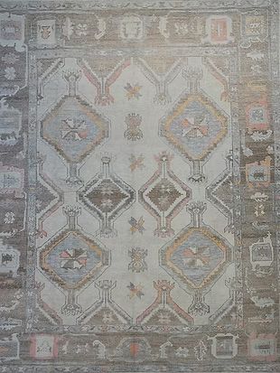 A rug with a pattern on it is sitting on a table.