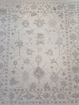 A rug with a floral pattern on it is sitting on a table.