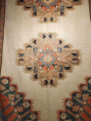 A close up of a rug with a geometric pattern on it.