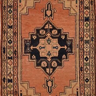A close up of a rug with a geometric pattern on it
