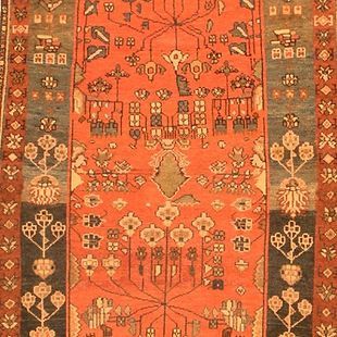 A close up of a rug with a floral pattern on it
