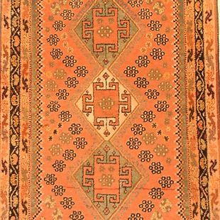 A close up of a rug with a pattern on it.