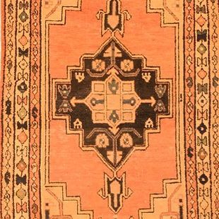 A close up of a rug with a geometric pattern