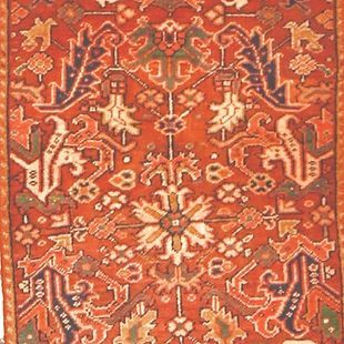 A red rug with a floral pattern on it
