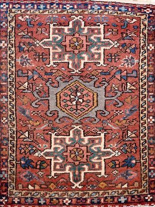 A close up of a rug with a geometric pattern on it.