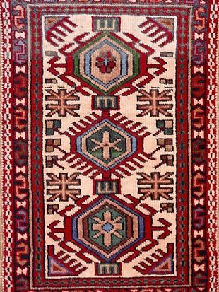 A close up of a rug with a geometric pattern on it.