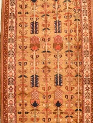 A rug with a pattern of arrows and flowers on it