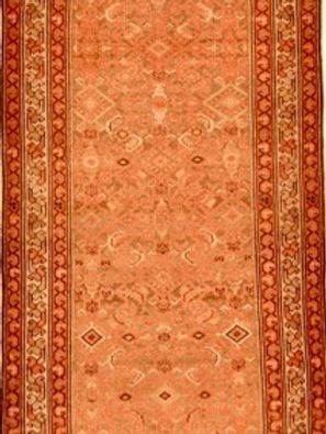 A close up of a rug with a pattern on it.
