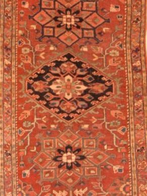 A close up of a rug with a geometric pattern