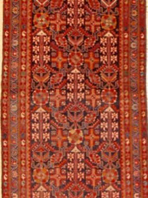 A close up of a rug with a pattern on it.