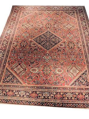 A large rug is sitting on top of a white surface.