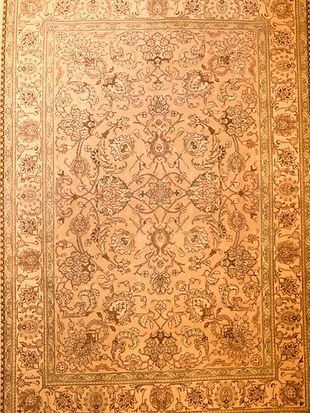A close up of a rug with a floral pattern on it