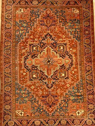 A close up of a rug with a pattern on it.
