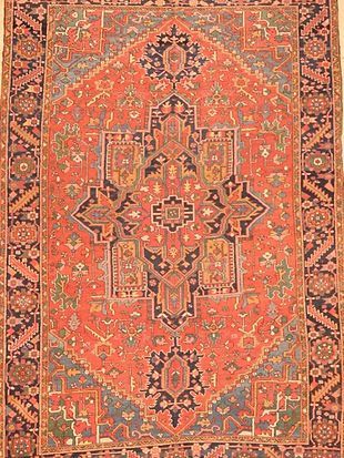 A close up of a rug with a pattern on it.