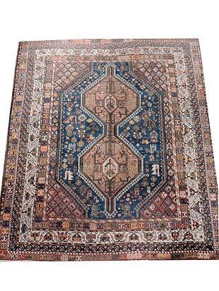 A square rug with a blue and brown pattern on a white background.
