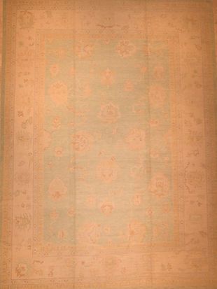 A rug with a floral pattern on it is sitting on a table.
