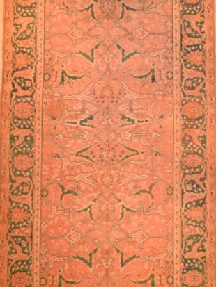 A close up of a rug with a floral pattern on it.