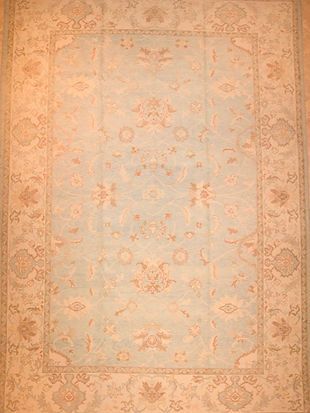A rug with a floral pattern on it is sitting on a table.