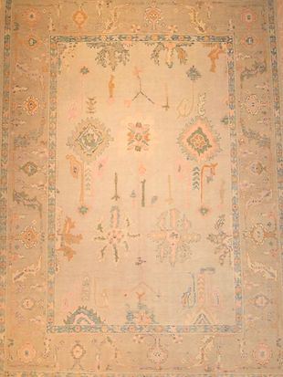 A close up of a rug with a floral pattern on it.