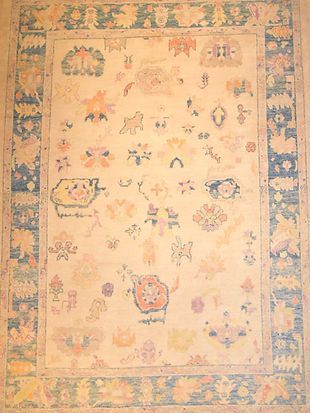 A rug with a floral pattern on it is sitting on a table.