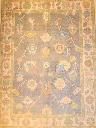 A rug with a floral pattern on it is sitting on a table.