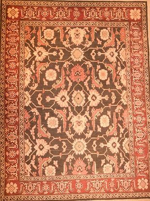 A rug with a floral pattern on it is sitting on a table.