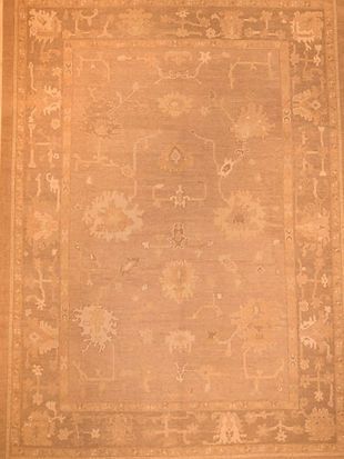 A close up of a rug with a floral pattern on it.