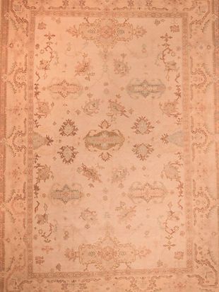 A close up of a rug with a floral pattern on it.
