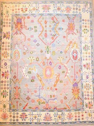 A rug with a floral pattern on it is sitting on a table.