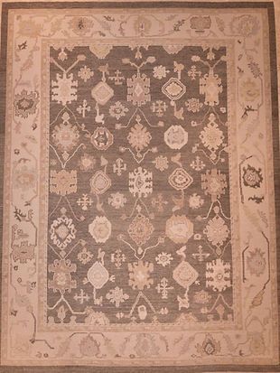 A rug with a floral pattern on it is sitting on a table.