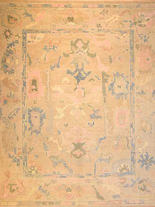 A close up of a rug with a floral pattern on it.