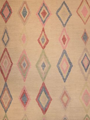 A close up of a rug with a pattern of diamonds on it.