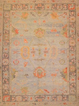 A close up of a rug with a floral pattern on it.