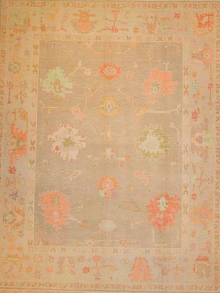 A rug with a floral pattern on it is sitting on a table.