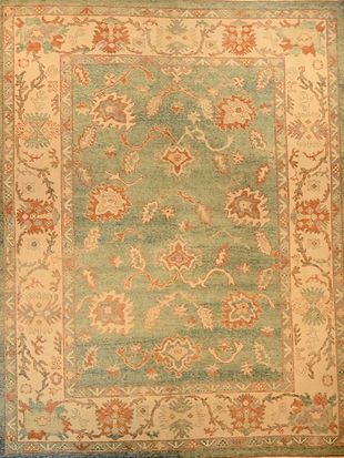 A rug with a floral pattern on it is sitting on a table.